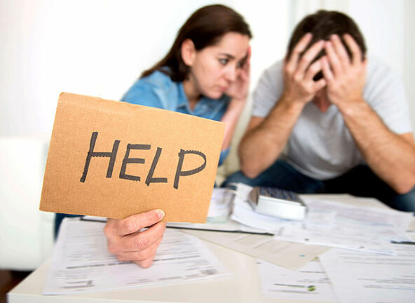 couple holding Help sign