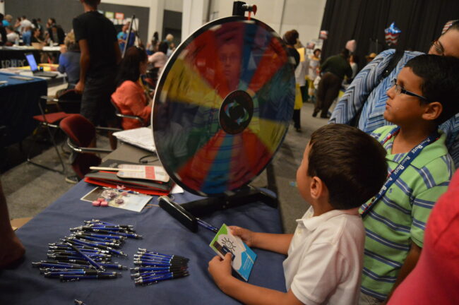 Kid spinning a wheel to win a prize