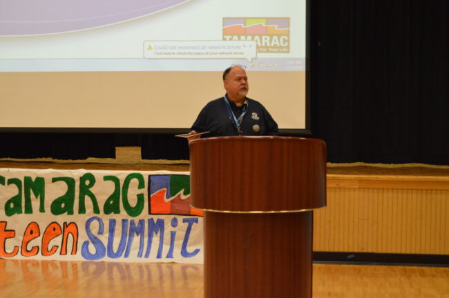 Man speaking at podium at the Tamarac Teen Summit